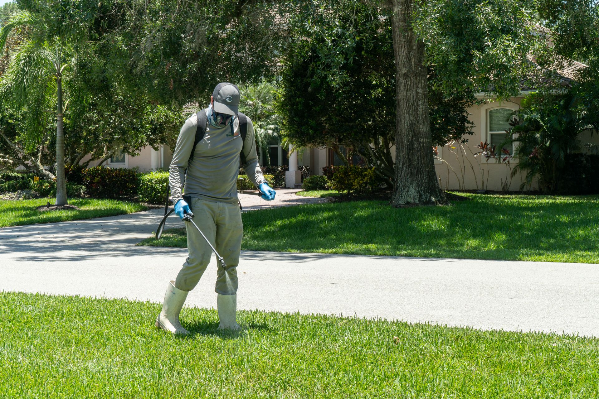 A GreenEdge staff member skillfully spraying a lawn in Bradenton. Our team uses effective techniques to control pests, weeds, or enhance the health of the grass. Trust GreenEdge for professional lawn spraying services that result in a lush and vibrant lawn.